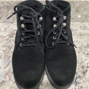 Black tie UGG boots.